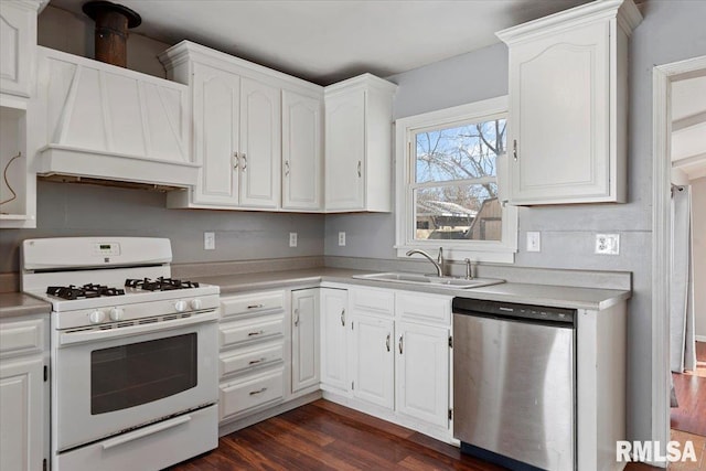 kitchen with a sink, white range with gas cooktop, white cabinets, and stainless steel dishwasher