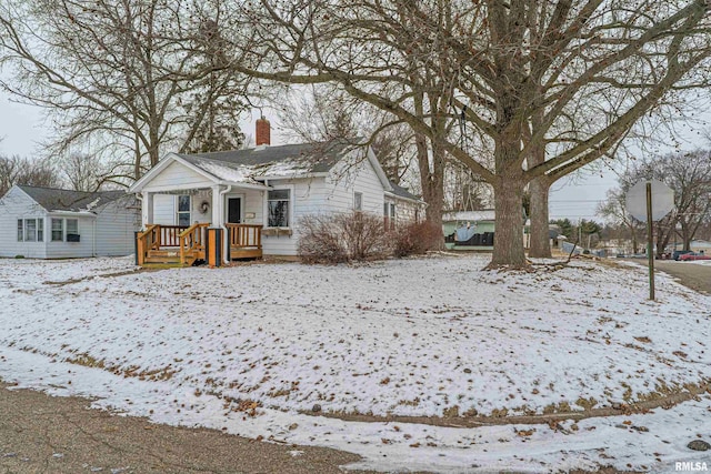 bungalow featuring a chimney