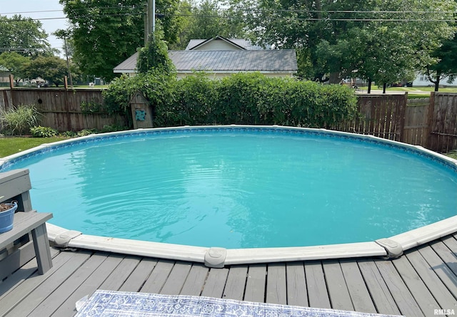 102 W Lorton St, Roodhouse, IL 62082 - view of swimming pool featuring a deck and a fenced backyard