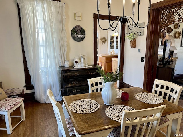 102 W Lorton St, Roodhouse, IL 62082 - dining room with a chandelier and wood finished floors