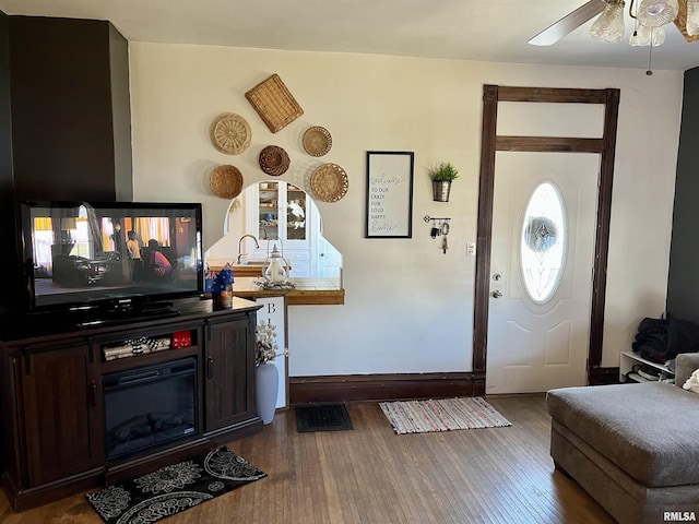 102 W Lorton St, Roodhouse, IL 62082 - foyer entrance with hardwood / wood-style flooring, ceiling fan, and baseboards