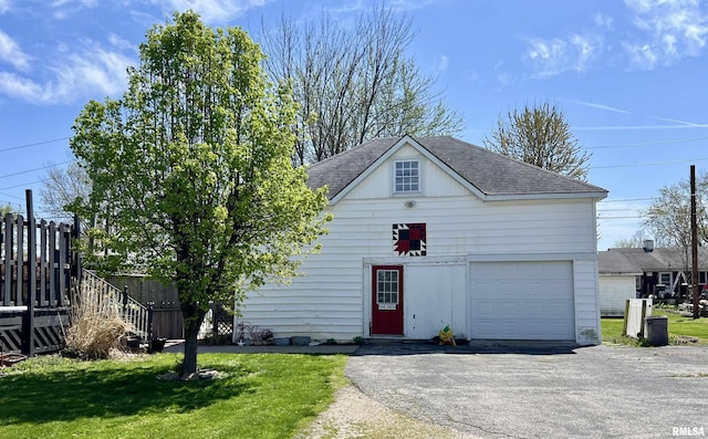 102 W Lorton St, Roodhouse, IL 62082 - view of front of home with a shingled roof and asphalt driveway