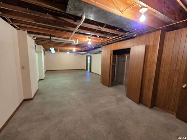 unfinished basement with wood walls