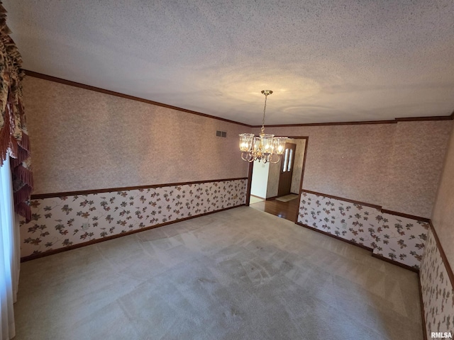 empty room with wallpapered walls, crown molding, and a textured ceiling