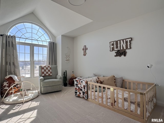 bedroom featuring lofted ceiling, multiple windows, and carpet flooring