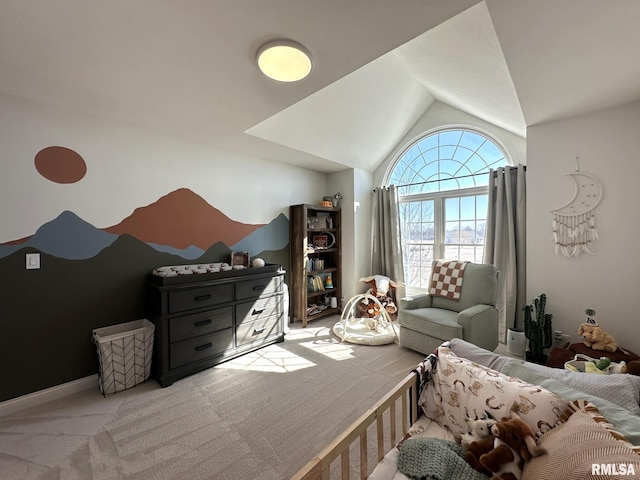 carpeted bedroom featuring lofted ceiling and baseboards