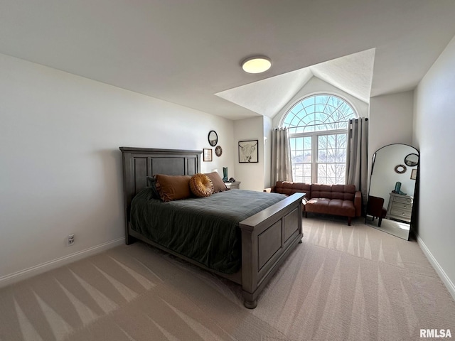 bedroom featuring vaulted ceiling, baseboards, and light colored carpet