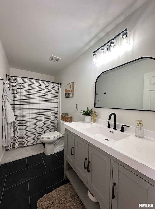 bathroom featuring curtained shower, tile patterned flooring, toilet, vanity, and visible vents