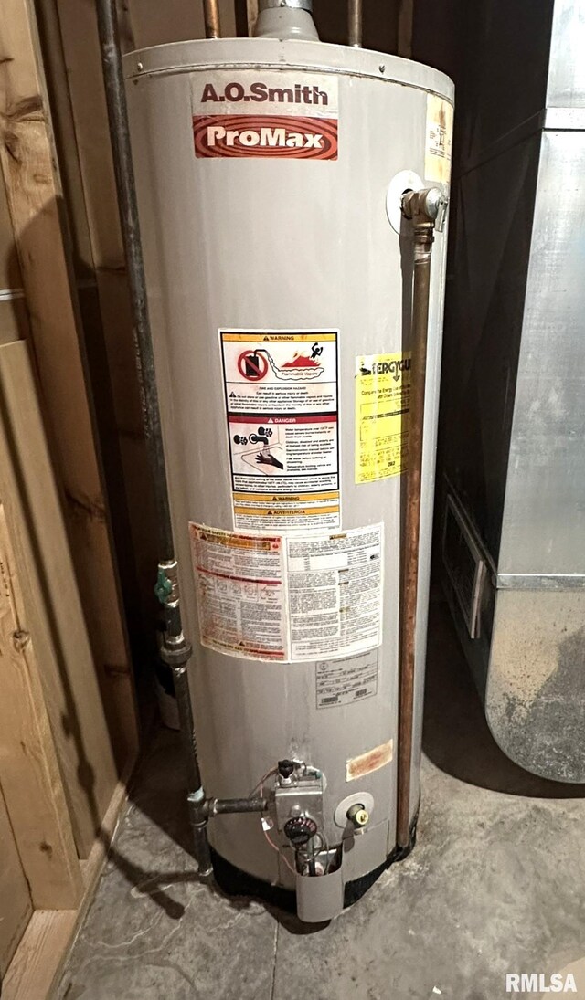 utility room featuring water heater