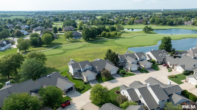 birds eye view of property with golf course view, a water view, and a residential view