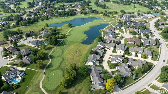 birds eye view of property featuring golf course view, a water view, and a residential view