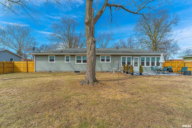 rear view of property with a yard, crawl space, fence, and a patio