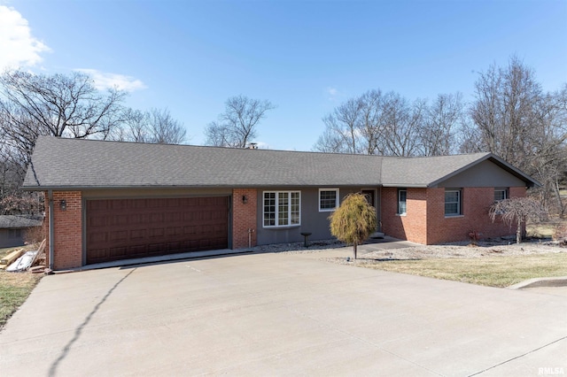 ranch-style home with a garage, driveway, brick siding, and roof with shingles