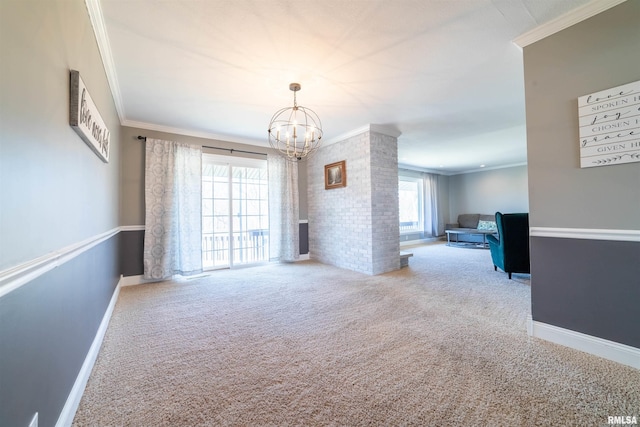 carpeted empty room featuring ornamental molding, baseboards, and an inviting chandelier