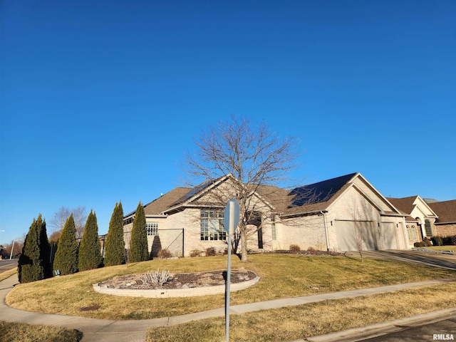 view of front of house with a garage, driveway, a front lawn, and stucco siding