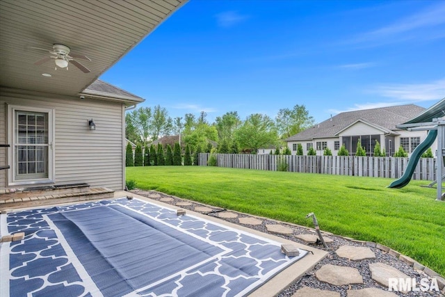 view of patio / terrace featuring ceiling fan and fence
