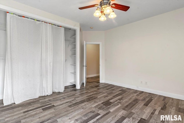 unfurnished bedroom with baseboards, ceiling fan, a closet, and wood finished floors