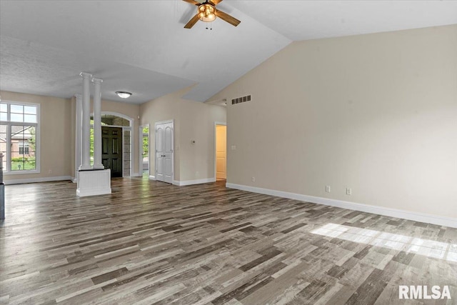 unfurnished living room with baseboards, a ceiling fan, wood finished floors, and visible vents