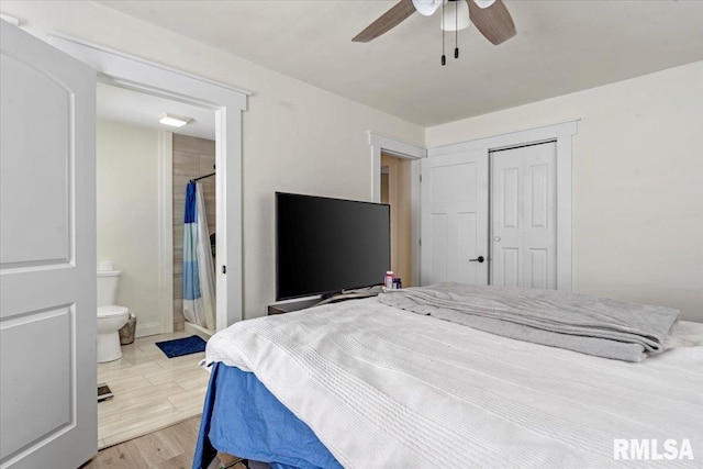 bedroom with a ceiling fan, a closet, ensuite bath, and light wood finished floors