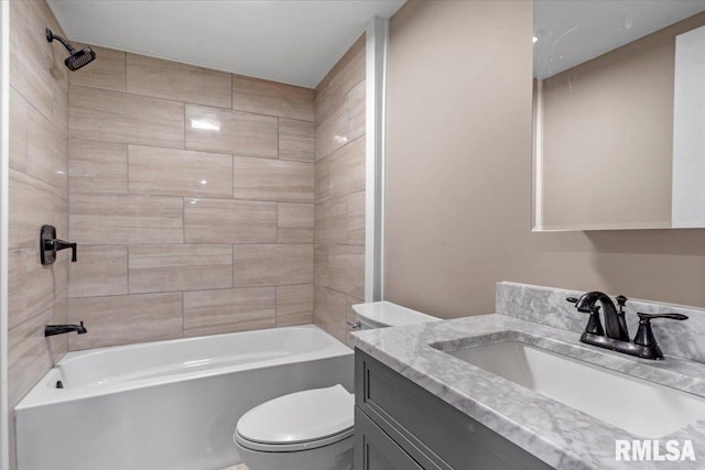 bathroom with toilet, shower / tub combination, and vanity