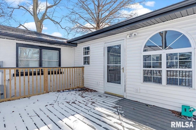 view of snow covered deck