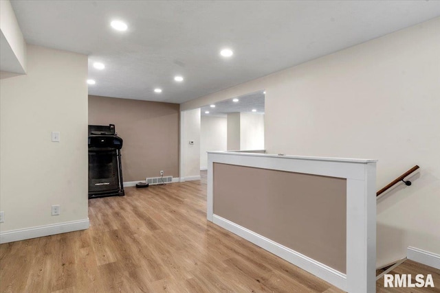 kitchen featuring recessed lighting, baseboards, visible vents, and light wood finished floors