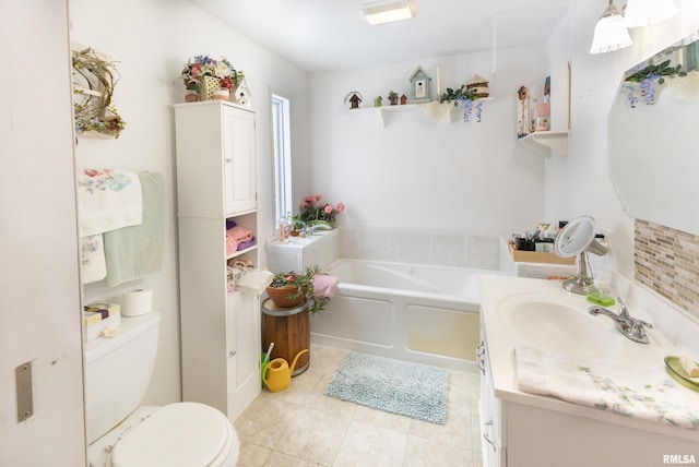 full bath featuring tile patterned flooring, vanity, toilet, and a bath