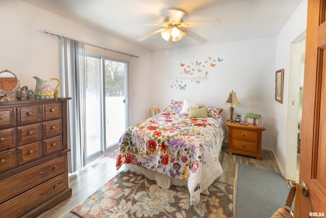 bedroom with light wood-style floors, access to outside, ceiling fan, and baseboards