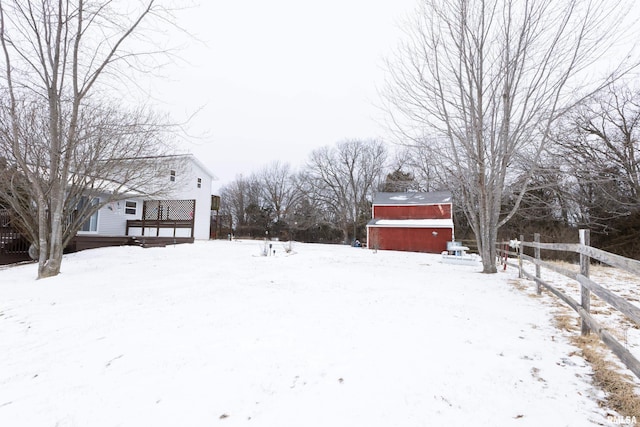 yard covered in snow with a garage