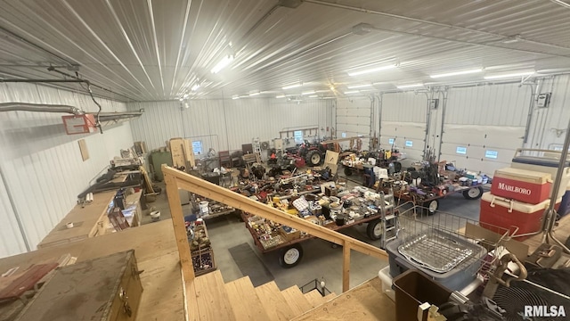 garage with metal wall and a workshop area