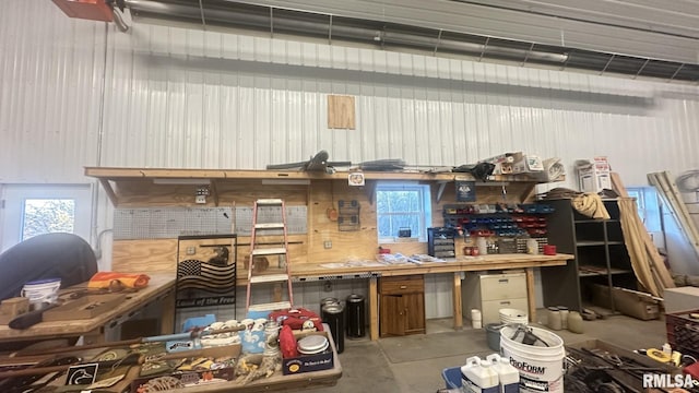 interior space featuring concrete floors and a workshop area