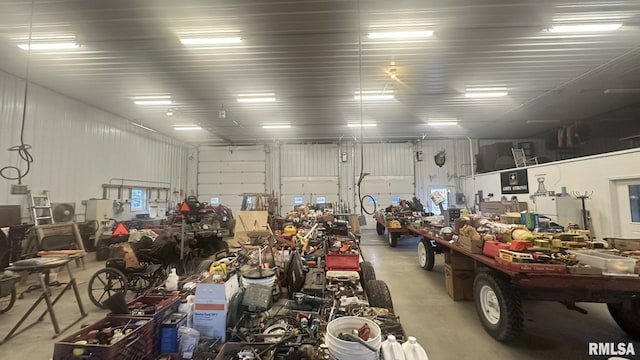 garage featuring a workshop area and metal wall