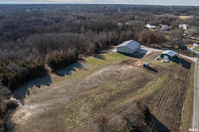 aerial view featuring a rural view and a view of trees