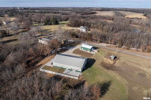 birds eye view of property with a rural view