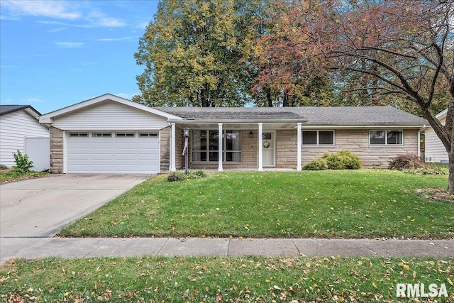 ranch-style home featuring a front yard, stone siding, an attached garage, and concrete driveway