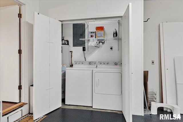 washroom with laundry area, electric panel, and washing machine and clothes dryer