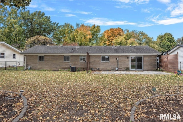 back of house with a yard, cooling unit, a patio area, and fence