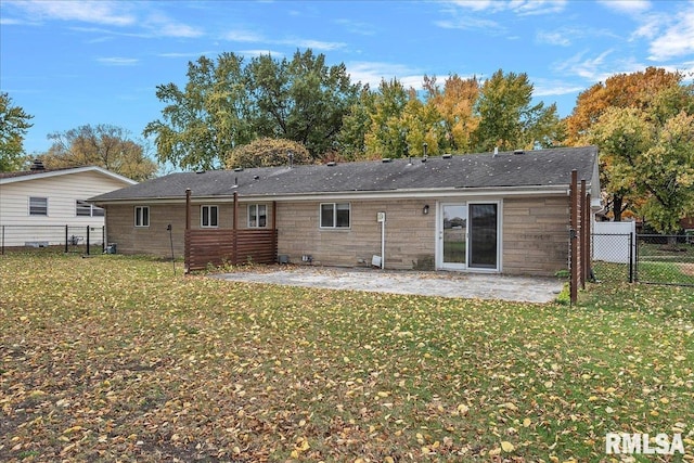 back of house with a yard, a patio area, and fence