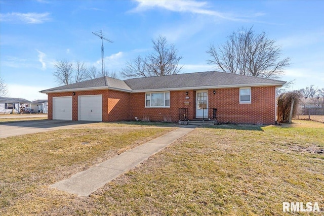 ranch-style home with a garage, driveway, brick siding, and a front lawn