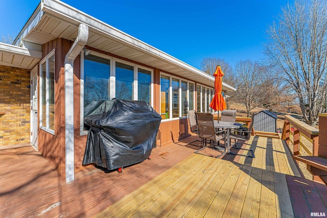 wooden deck with outdoor dining space