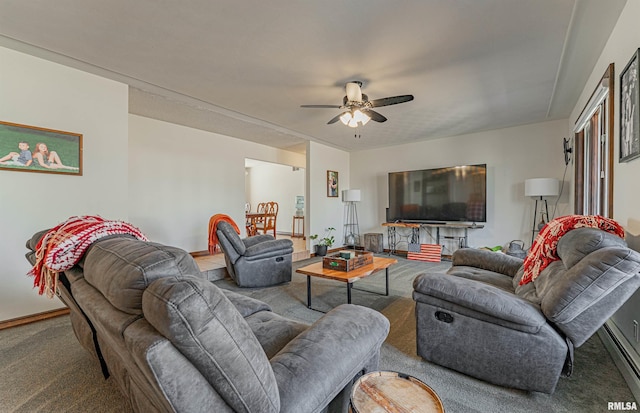 carpeted living area featuring a ceiling fan