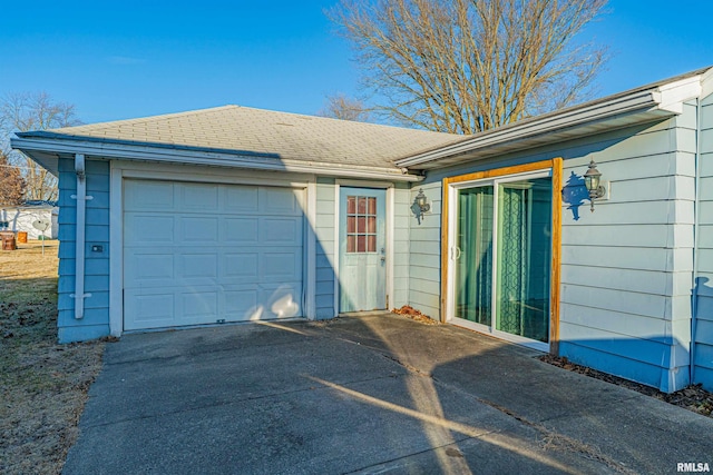 exterior space featuring a garage and driveway