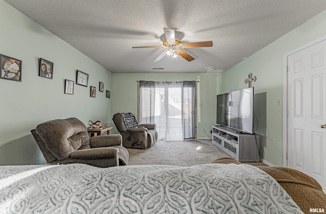 bedroom featuring visible vents, ceiling fan, access to exterior, carpet, and a textured ceiling