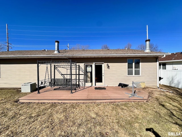 back of house featuring a yard, a deck, and fence