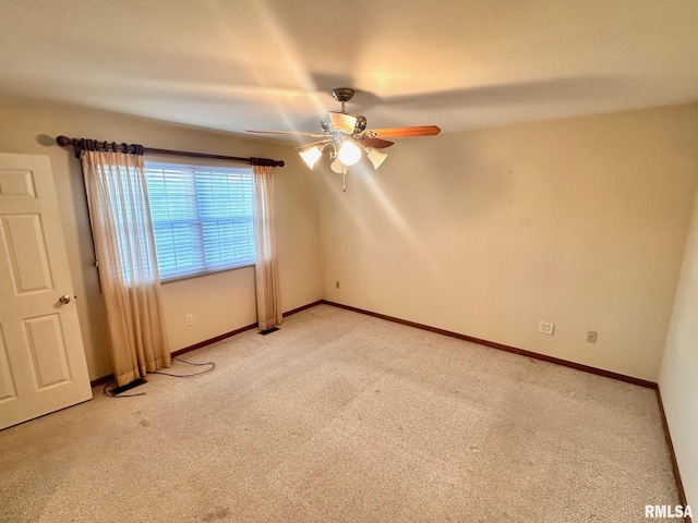 unfurnished room with light carpet, ceiling fan, and baseboards