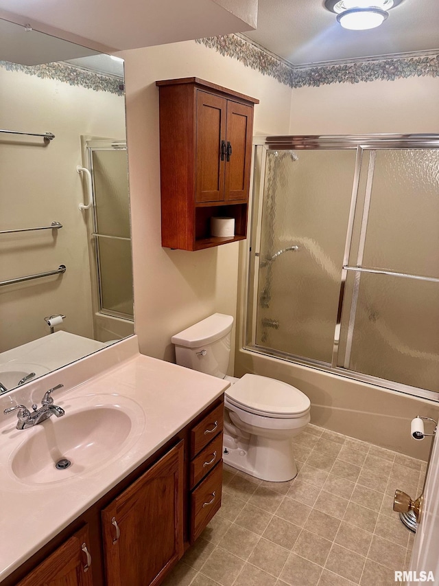 bathroom with combined bath / shower with glass door, vanity, and toilet