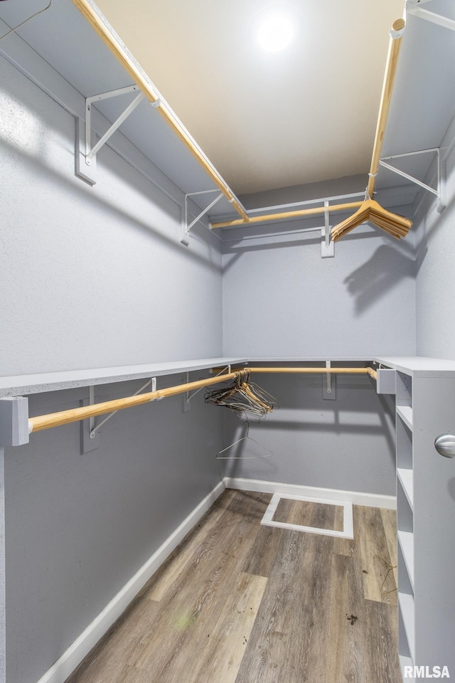 spacious closet with wood finished floors