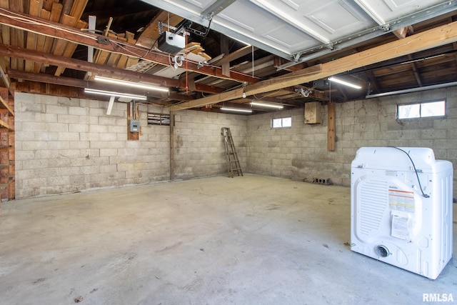 basement featuring a garage and a healthy amount of sunlight