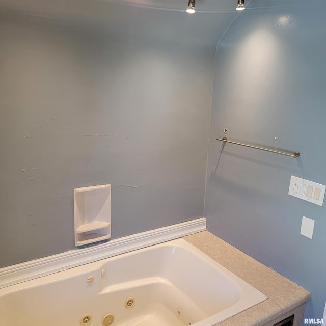 bathroom with a jetted tub