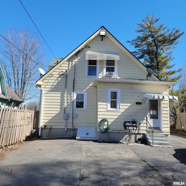 back of house featuring fence and a patio